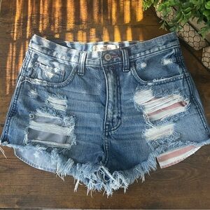 Hollister Women's Ripped Blue Jean Shorts with American flag pockets underlay
